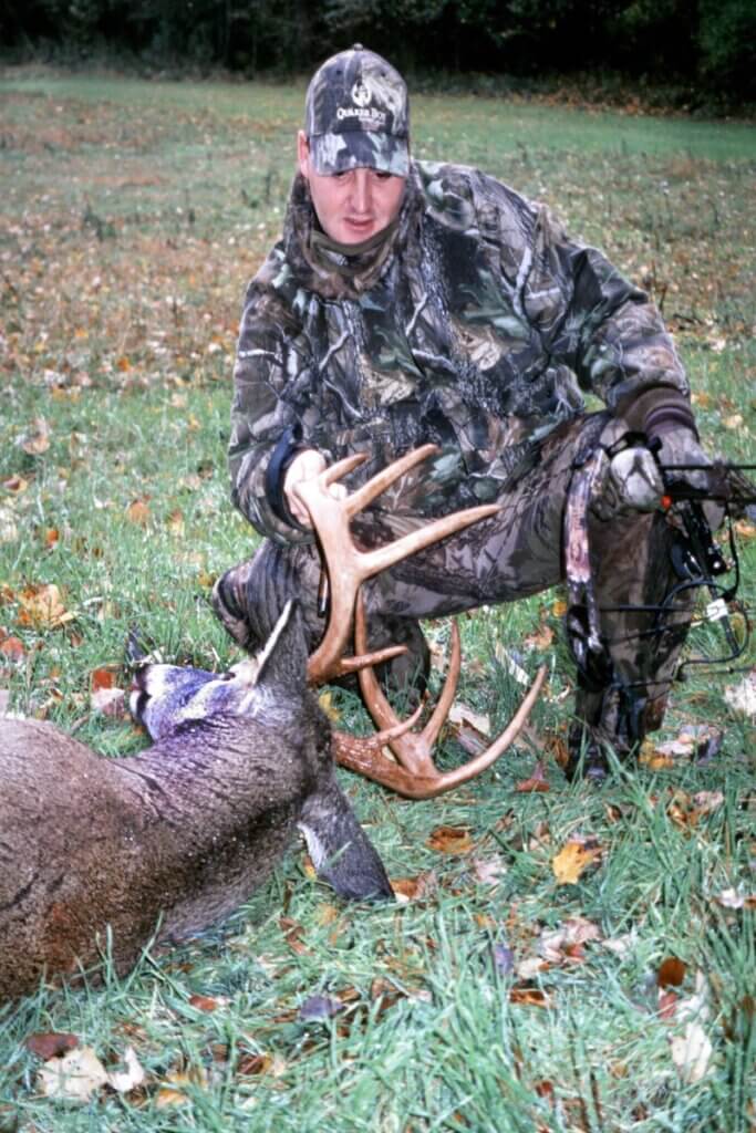 A hunter and his trophy buck