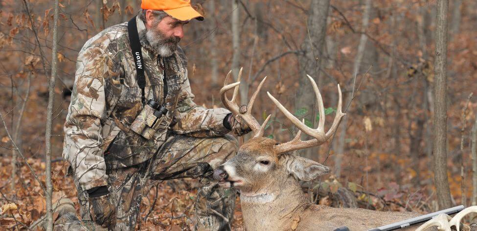 Deer hunter and his trophy