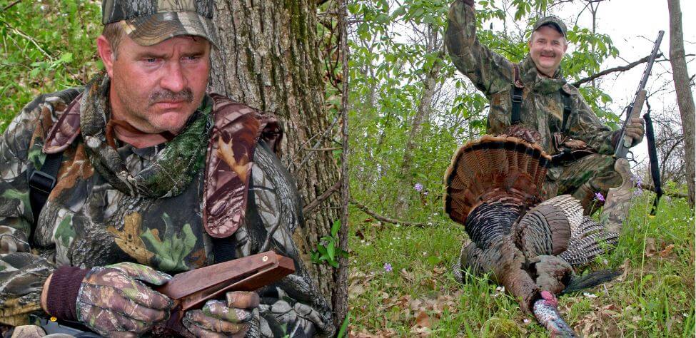 Turkey hunter and a turkey hunter with his trophy