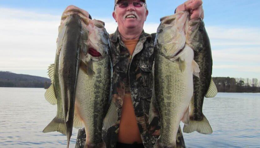 Gary Klein with two bass trophies