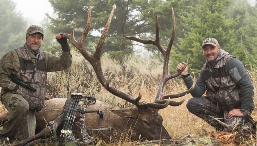 Elk hunters with their elk