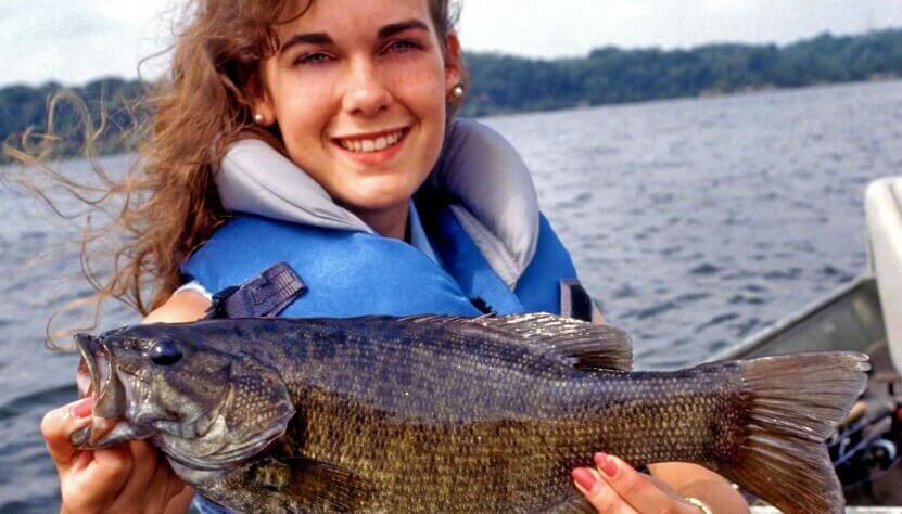 Bass fisherwoman with bass