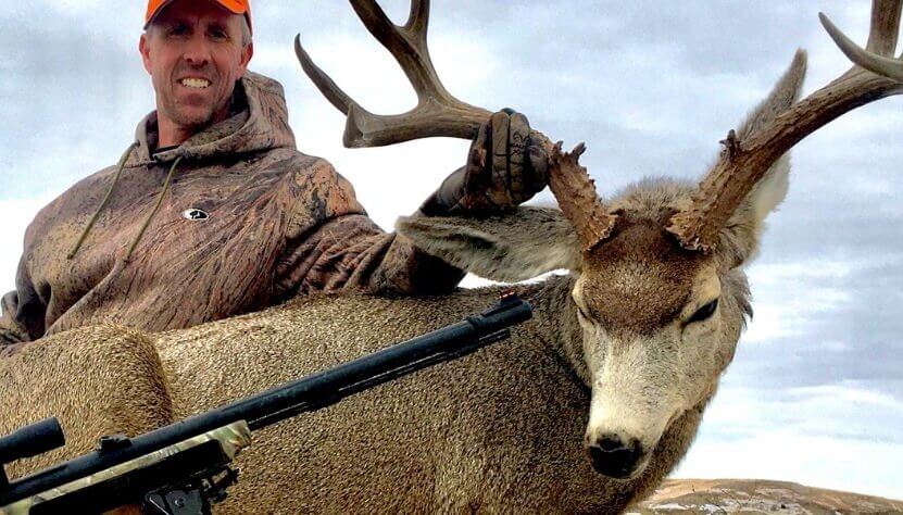 Hunter with his deer trophy