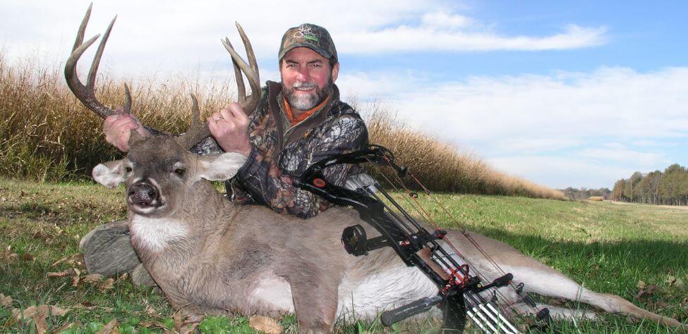 Deer hunter with his trophy.