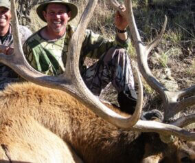 Elk hunters with their trophy elk